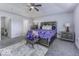 Main bedroom with carpet, large bed, and grey dresser at 2539 Shadowbrook Trce, Greenwood, IN 46143