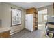 Bright kitchen features white appliances and wood cabinets at 308 E 36Th St, Anderson, IN 46013