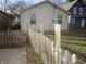 Home features a fenced backyard with a concrete patio at 317 N Bradley Ave, Indianapolis, IN 46201