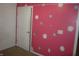 Pink bedroom with white and teal polka dots at 317 N Bradley Ave, Indianapolis, IN 46201
