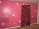Bright bedroom with painted walls and maroon curtains at 317 N Bradley Ave, Indianapolis, IN 46201