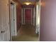 Long hallway with carpet and doors at 317 N Bradley Ave, Indianapolis, IN 46201