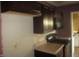 Kitchen features dark brown cabinets at 317 N Bradley Ave, Indianapolis, IN 46201