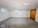 Spacious finished basement with neutral walls and carpeting at 3309 N Riley Ave, Indianapolis, IN 46218