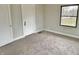 Spacious bedroom with neutral walls and carpet at 3563 Carrollton Ave, Indianapolis, IN 46205