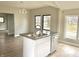 Updated kitchen featuring white cabinets and a kitchen island at 3563 Carrollton Ave, Indianapolis, IN 46205