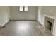 Living room with fireplace and gray vinyl plank flooring at 3563 Carrollton Ave, Indianapolis, IN 46205