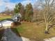 Aerial view of farmhouse, detached garage, and expansive yard at 3677 E 600 N, Shelbyville, IN 46176