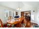 Bright dining area with hardwood floors and access to the kitchen at 5101 W Quincy Ct, Columbus, IN 47203