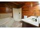 Bathroom with double vanity, shower, and tub at 5360 N Carroll Rd, Indianapolis, IN 46235