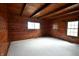 Spacious bedroom with wood walls and two windows at 5360 N Carroll Rd, Indianapolis, IN 46235