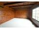 Empty bedroom with wood walls and large window at 5360 N Carroll Rd, Indianapolis, IN 46235