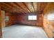 Simple bedroom with wood walls and a door at 5360 N Carroll Rd, Indianapolis, IN 46235