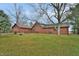 Back of log cabin home with green door at 5360 N Carroll Rd, Indianapolis, IN 46235