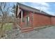 Side view of log cabin home with wooden deck at 5360 N Carroll Rd, Indianapolis, IN 46235