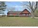 Rustic log cabin home with a spacious yard at 5360 N Carroll Rd, Indianapolis, IN 46235