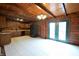 Open kitchen with wood cabinets, black appliances, and tile floors at 5360 N Carroll Rd, Indianapolis, IN 46235