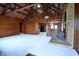 Spacious living room with wood walls and a wood-burning stove at 5360 N Carroll Rd, Indianapolis, IN 46235