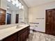 Accessible bathroom with walk-in shower, grab bars, and updated vanity at 5375 E Commons West Dr, Mooresville, IN 46158