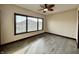 Bright bedroom with wood flooring and large window at 5375 E Commons West Dr, Mooresville, IN 46158