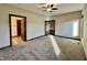 Well-lit bedroom featuring carpet and ensuite access at 5375 E Commons West Dr, Mooresville, IN 46158