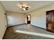 Spacious bedroom with ceiling fan and ensuite bathroom at 5375 E Commons West Dr, Mooresville, IN 46158
