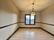 Bright dining room featuring hardwood floors and large window at 5375 E Commons West Dr, Mooresville, IN 46158