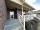 Inviting front porch with brick columns and white railing at 5375 E Commons West Dr, Mooresville, IN 46158