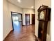 Bright hallway with hardwood floors and grandfather clock at 5375 E Commons West Dr, Mooresville, IN 46158