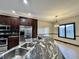 Modern kitchen with granite countertops and stainless steel appliances at 5375 E Commons West Dr, Mooresville, IN 46158
