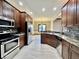 Modern kitchen with stainless steel appliances and granite counters at 5375 E Commons West Dr, Mooresville, IN 46158