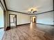 Large living room with hardwood floors and ceiling fan at 5375 E Commons West Dr, Mooresville, IN 46158