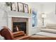 Cozy fireplace with white shiplap wall and decorative mantel at 5930 Crowley Pkwy, Whitestown, IN 46075