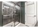 Large walk-in shower with gray tile and glass enclosure at 6364 Meadowview Dr, Whitestown, IN 46075