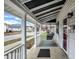 Inviting front porch features a swing and overlooks a residential street at 65 Central Ave, Franklin, IN 46131