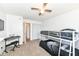 Well-lit bedroom with bunk beds, ceiling fan, and closet at 6565 Green Haven Way # D, Indianapolis, IN 46214