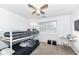 Cozy bedroom with bunk beds, window, and ceiling fan at 6565 Green Haven Way # D, Indianapolis, IN 46214