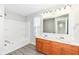 Bathroom boasts double vanity, tub shower combo, and wood cabinets at 6927 Park Grove Blvd, Whitestown, IN 46075