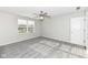 Bright bedroom with grey carpet, large window, and ceiling fan at 6927 Park Grove Blvd, Whitestown, IN 46075