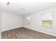 Spacious bedroom with wood-look flooring and two windows at 6927 Park Grove Blvd, Whitestown, IN 46075