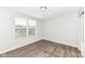 Bedroom with wood-look flooring and a window with blinds at 6927 Park Grove Blvd, Whitestown, IN 46075