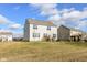 Two-story house with white siding and a charming backyard at 6927 Park Grove Blvd, Whitestown, IN 46075