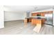Open kitchen with island, stainless steel appliances, and wood cabinets at 6927 Park Grove Blvd, Whitestown, IN 46075