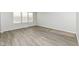 Living room with wood-look floors and lots of natural light at 6927 Park Grove Blvd, Whitestown, IN 46075