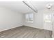 Bright living room featuring wood-look floors and neutral walls at 6927 Park Grove Blvd, Whitestown, IN 46075