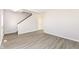 Open living area with gray walls and wood-look floors at 6927 Park Grove Blvd, Whitestown, IN 46075