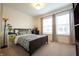 Bedroom with a full-size bed and large windows at 743 Bates St, Indianapolis, IN 46202