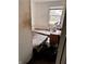 Bedroom with two stained mattresses and a window at 8434 Meadowlark Dr, Indianapolis, IN 46226