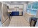 Modern kitchen with stainless steel appliances and blue cabinets at 11064 Oakridge Dr, Fishers, IN 46038