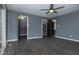 Spacious bedroom with gray walls, dark flooring, and ceiling fan at 1128 Palo Vista Rd, Greenwood, IN 46143